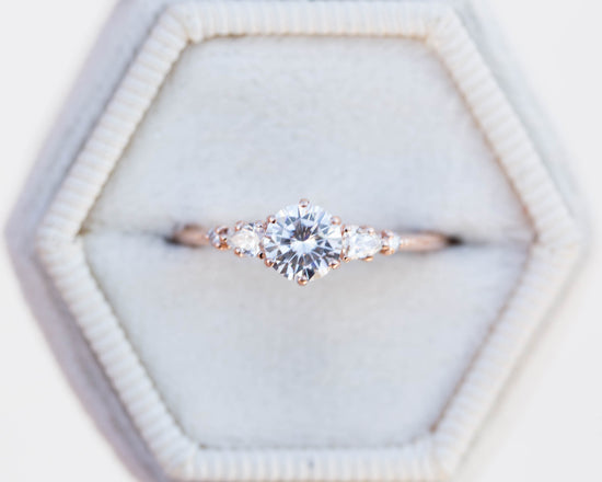 Moissanite and diamond five stone engagement ring