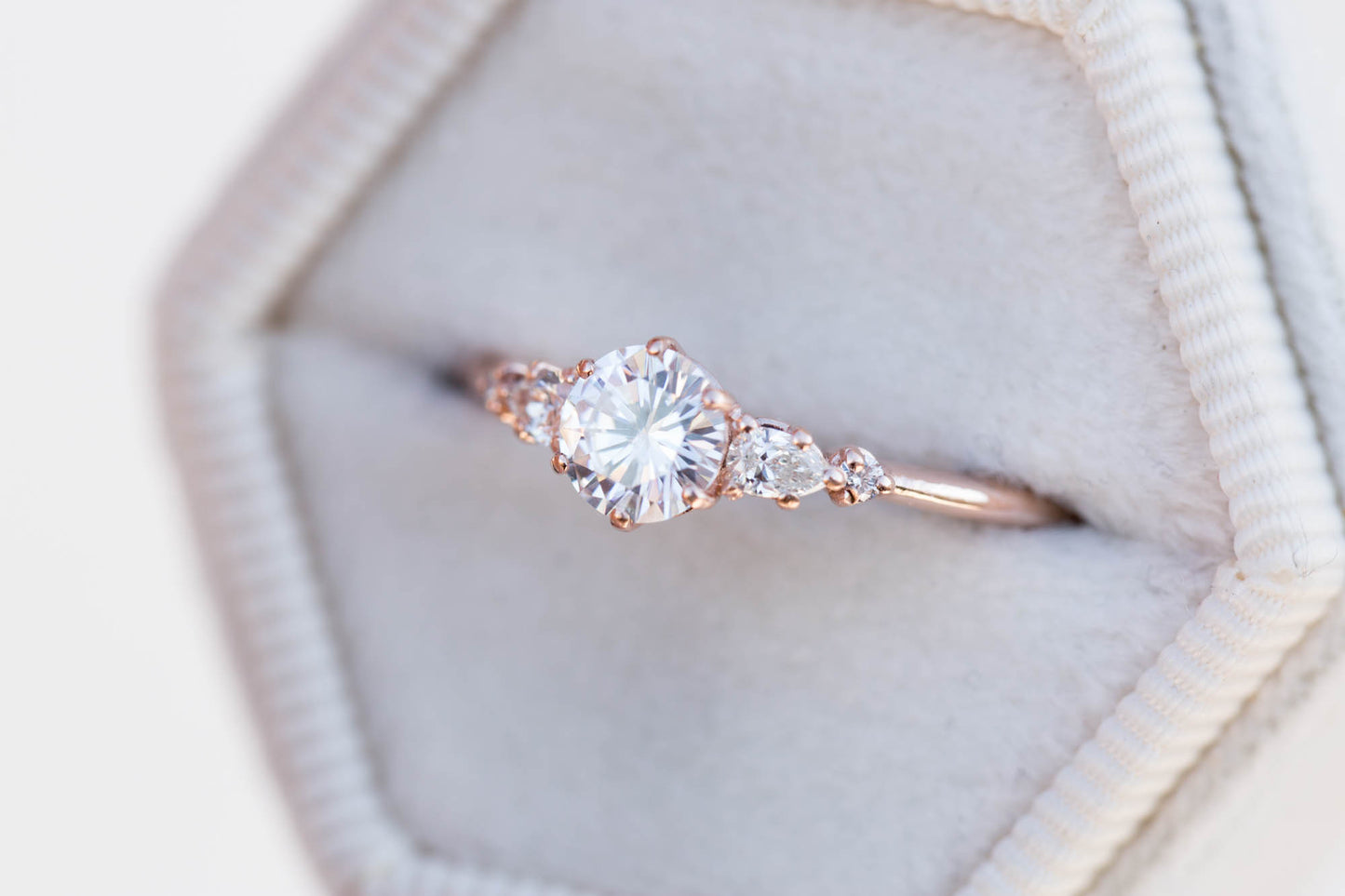 Moissanite and diamond five stone engagement ring