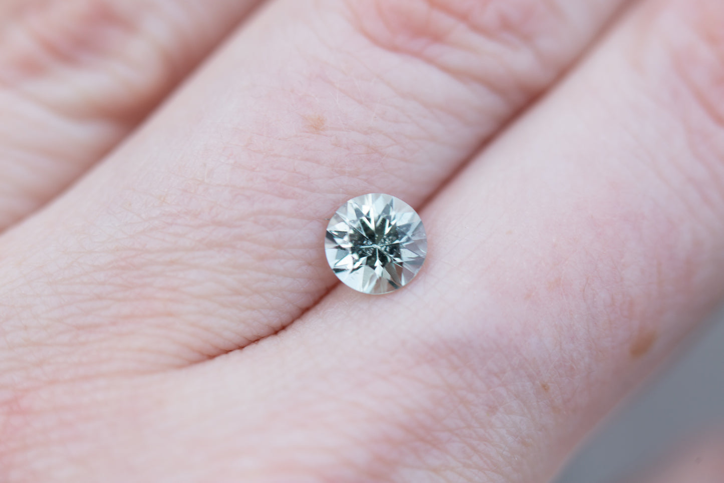 Load image into Gallery viewer, 1.12ct round light minty green sapphire
