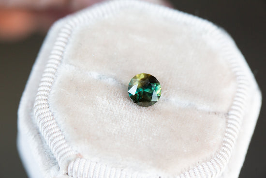 1.35ct round opaque brown green sapphire