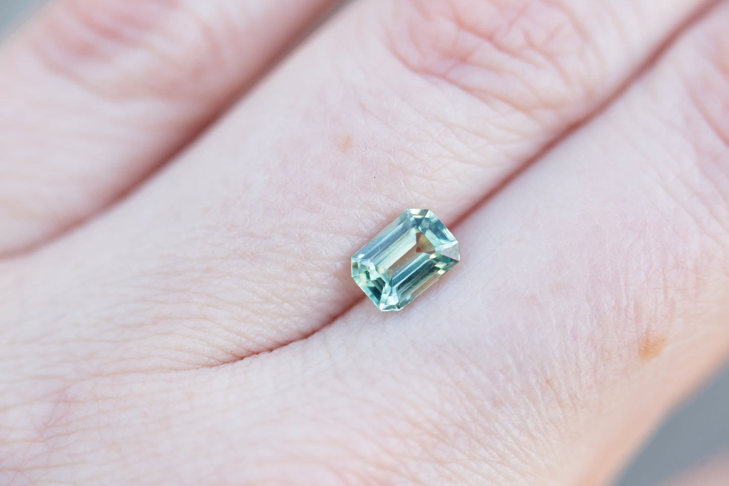 1.22ct emerald cut light teal sapphire