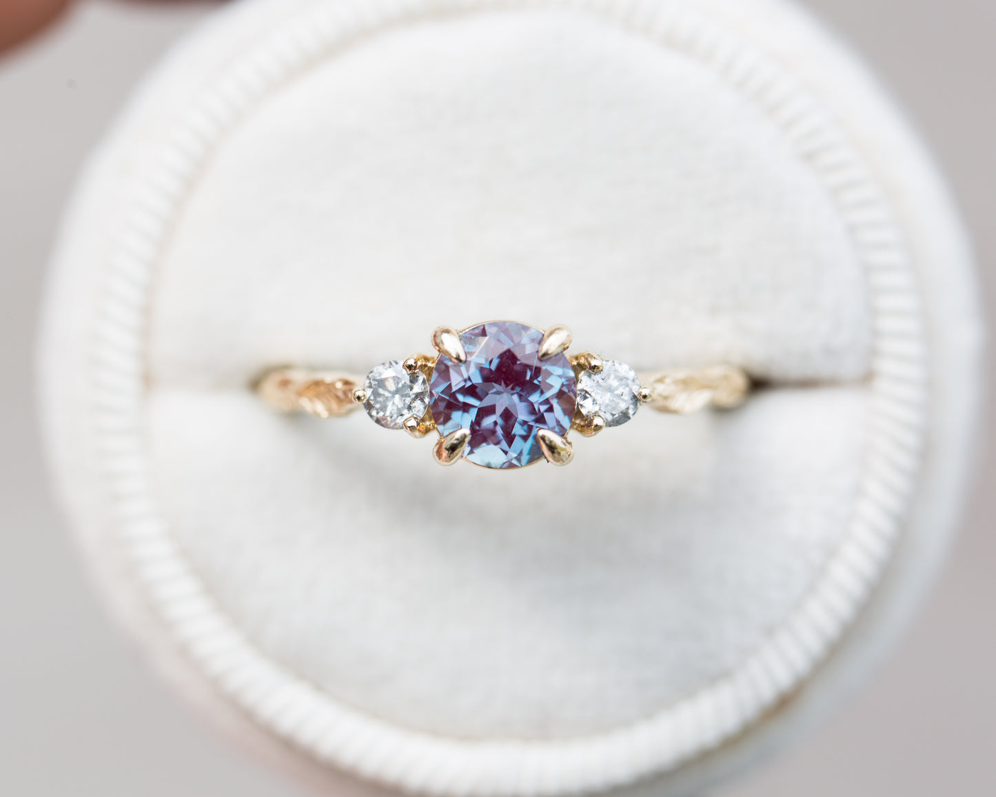Round alexandrite and grey diamond leaf engagement ring