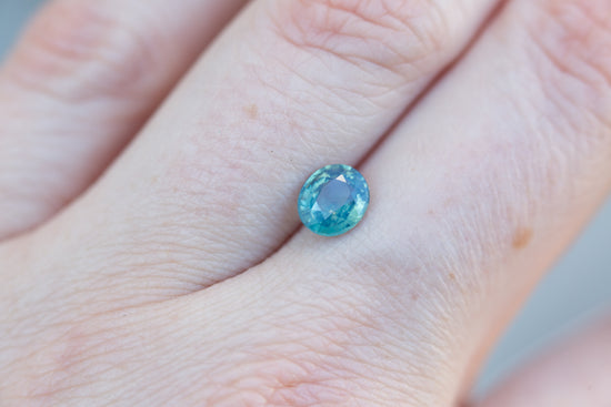 Load image into Gallery viewer, 1.15ct oval opalescent teal sapphire
