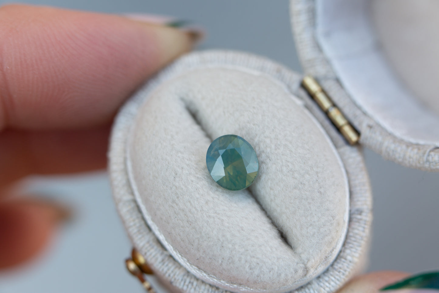 Load image into Gallery viewer, 1.36ct oval opalescent green teal sapphire

