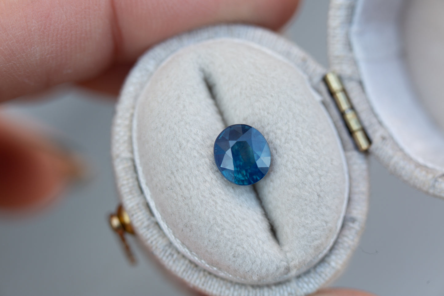 1.63ct oval opalescent teal blue sapphire