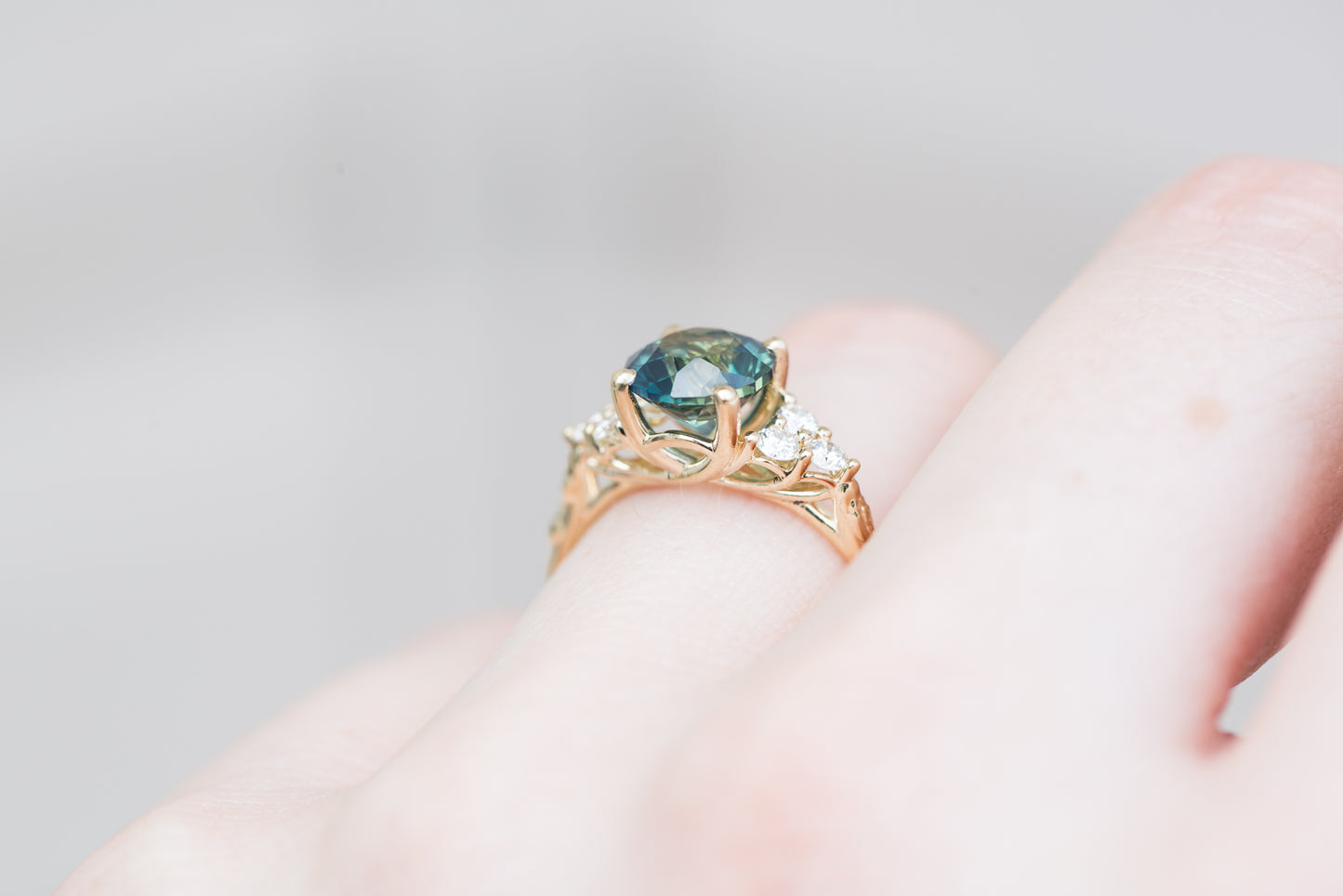 2.4ct round teal sapphire cluster ring, seraphina setting