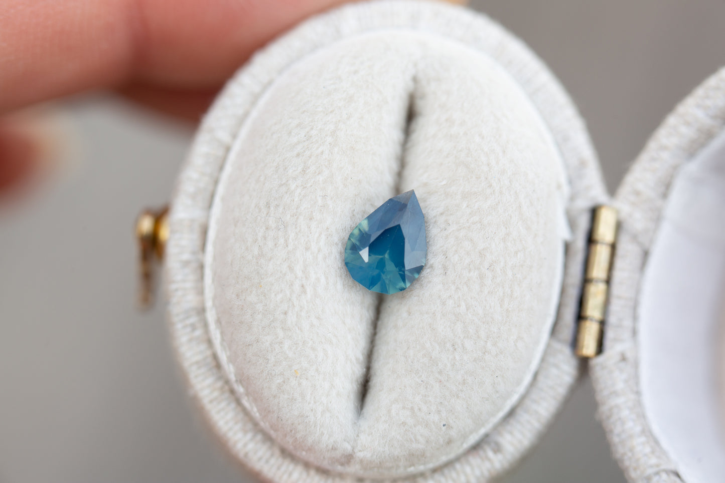 Load image into Gallery viewer, .76ct pear opalescent blue teal sapphire
