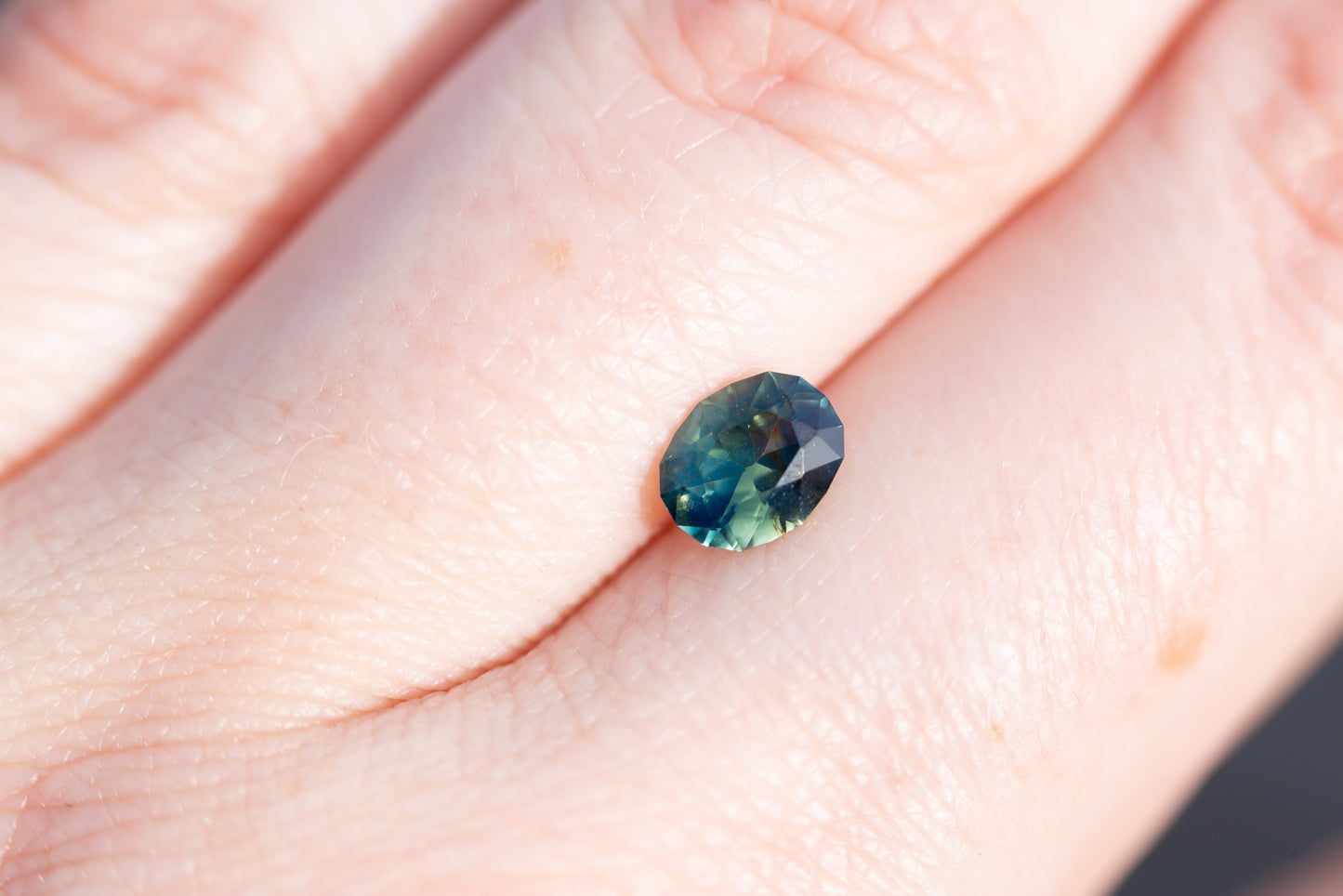 .93ct oval opalescent blue green bi color sapphire