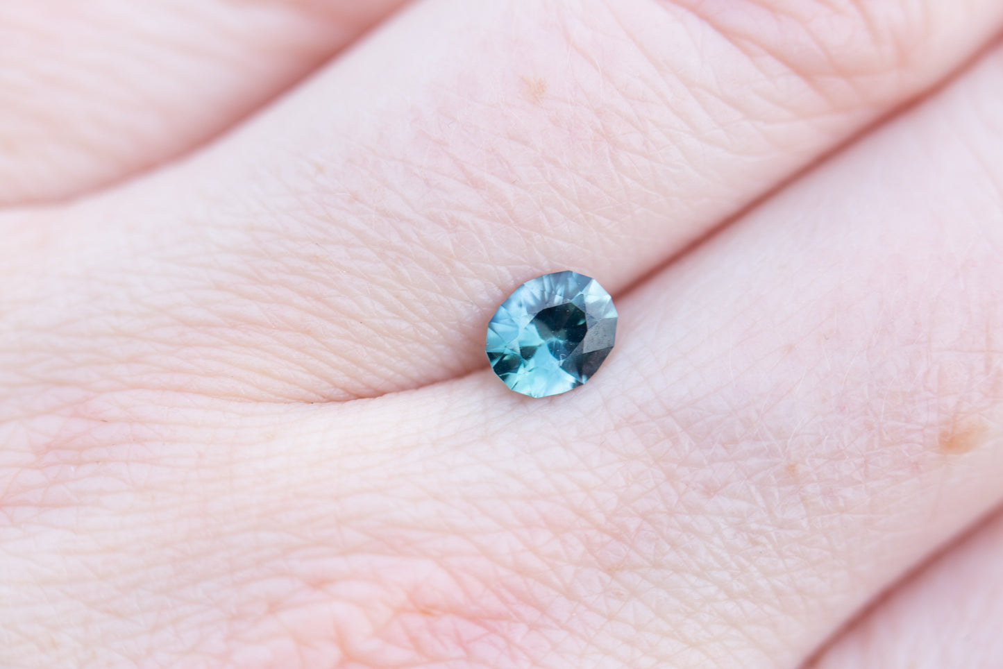 .83ct oval opalescent teal blue sapphire