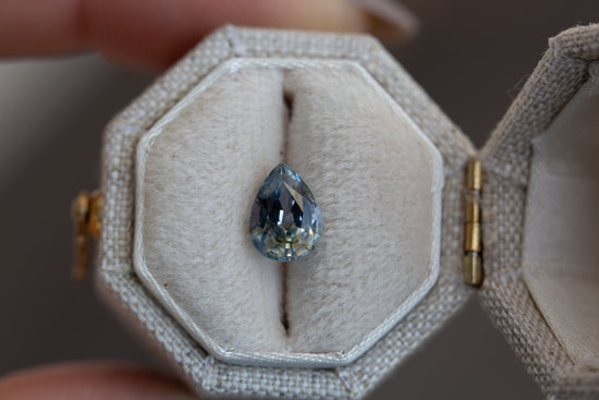 1.48ct pear blue sapphire with yellow zoning