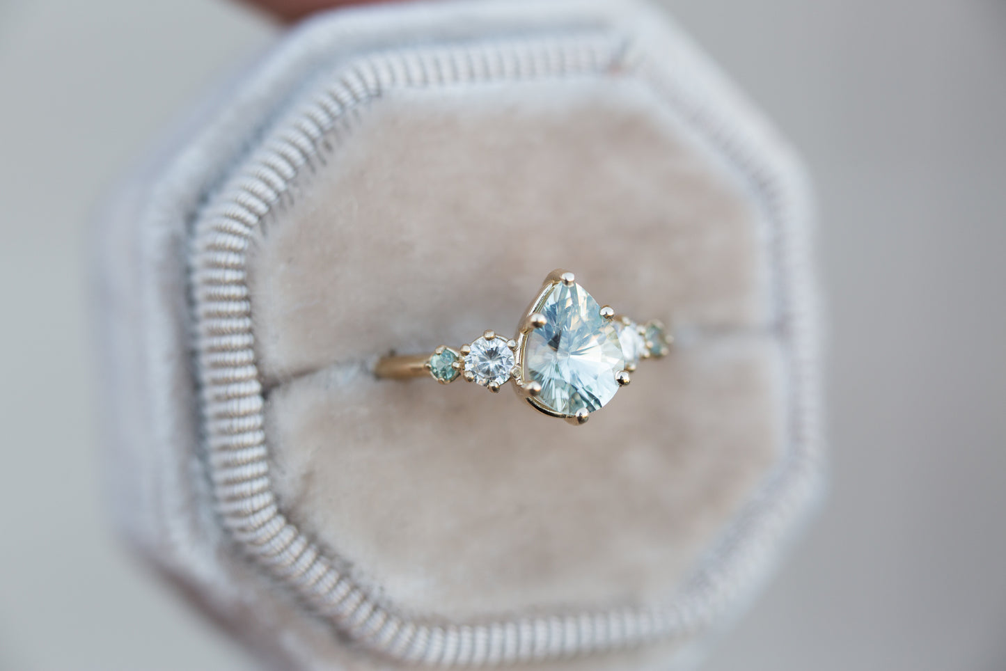 Pastel seafoam pear sapphire five stone ring with diamond side stones