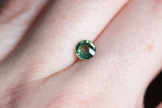 1.1ct round teal green sapphire