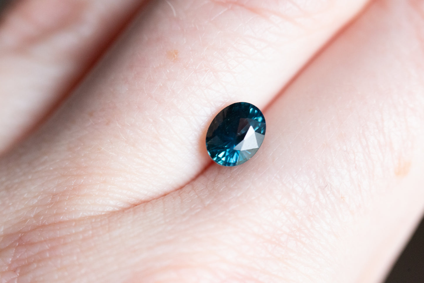 Load image into Gallery viewer, 1.52ct oval deep teal blue sapphire
