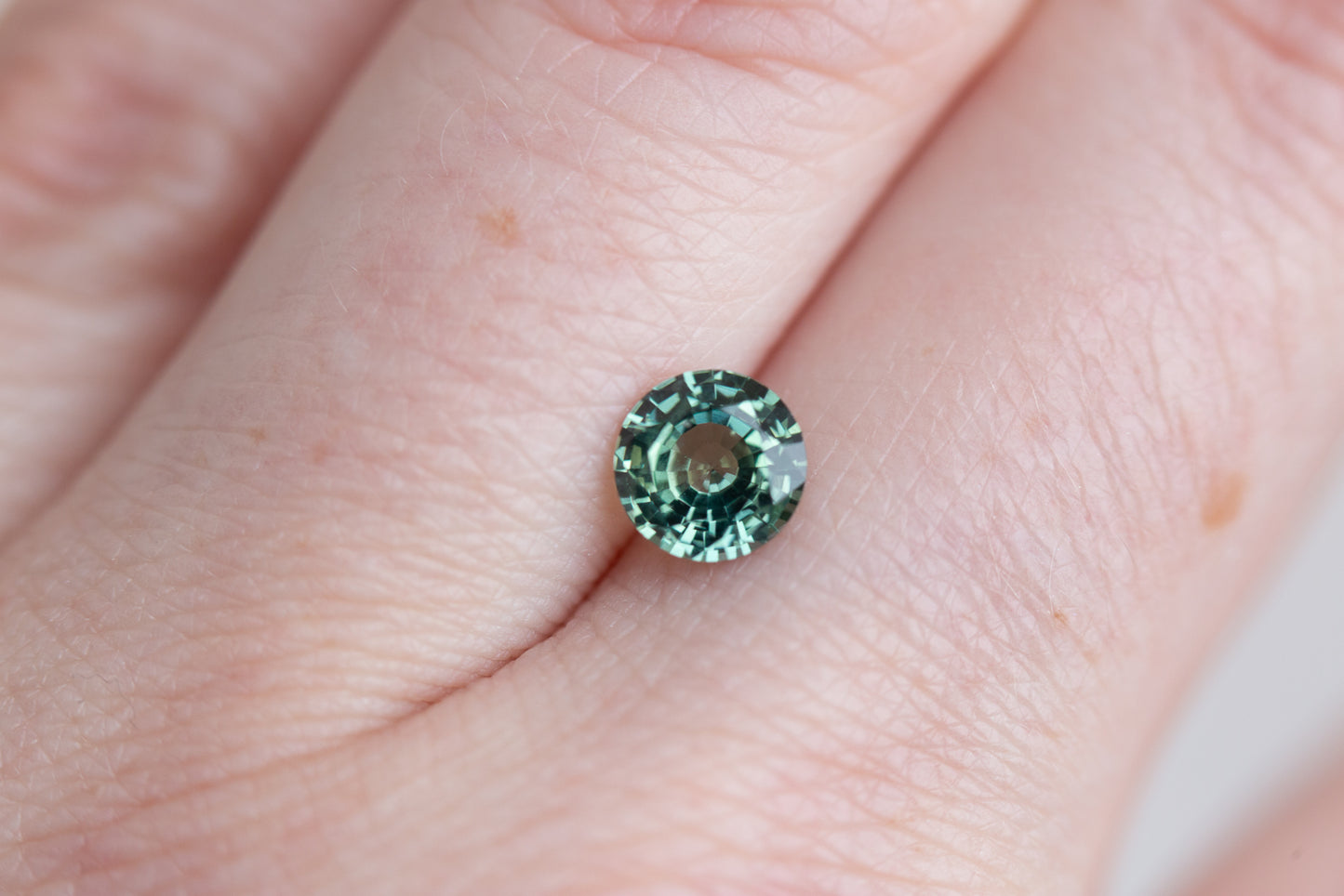 1.21ct round green teal sapphire