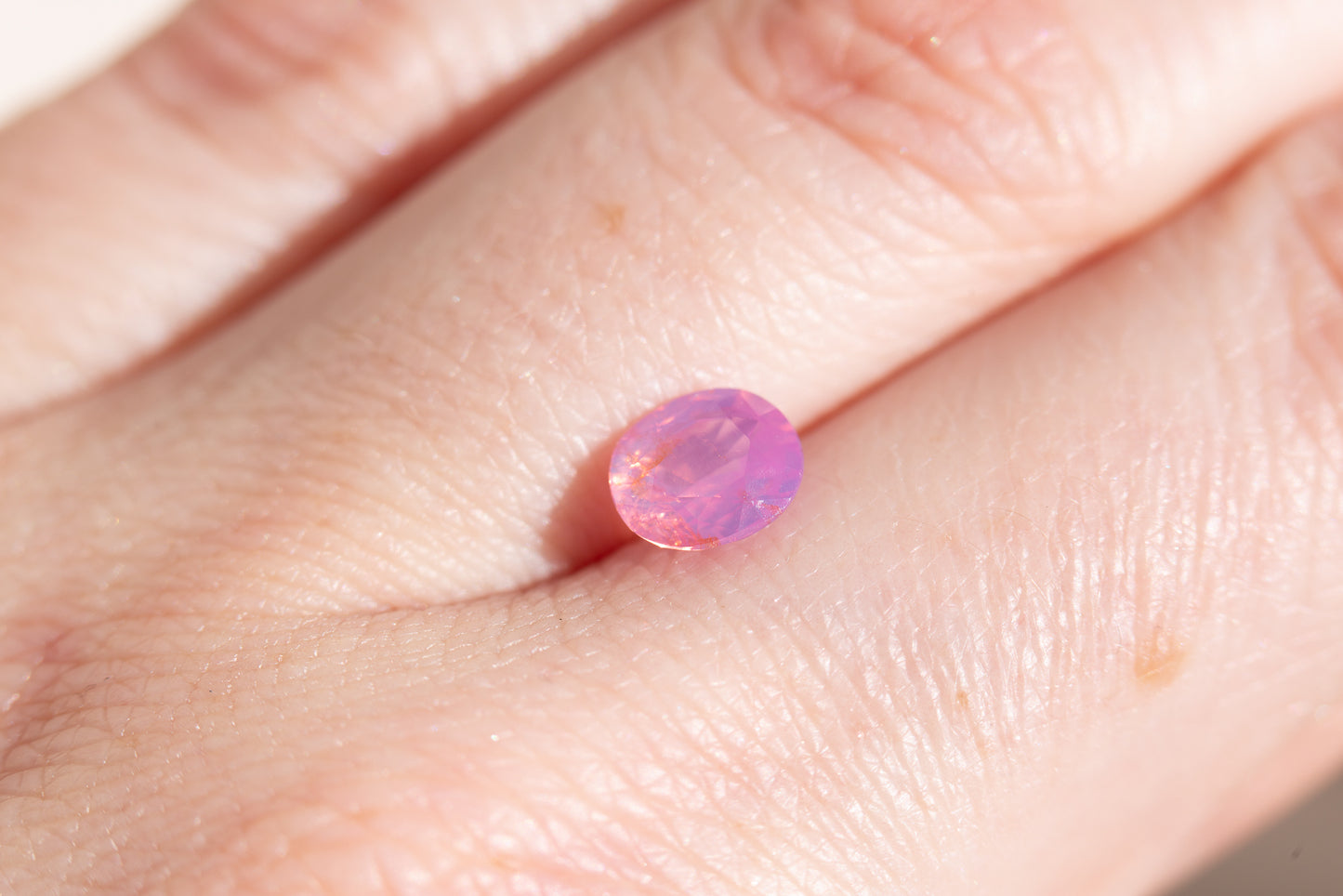 1.41ct oval opalescent pink orange sapphire