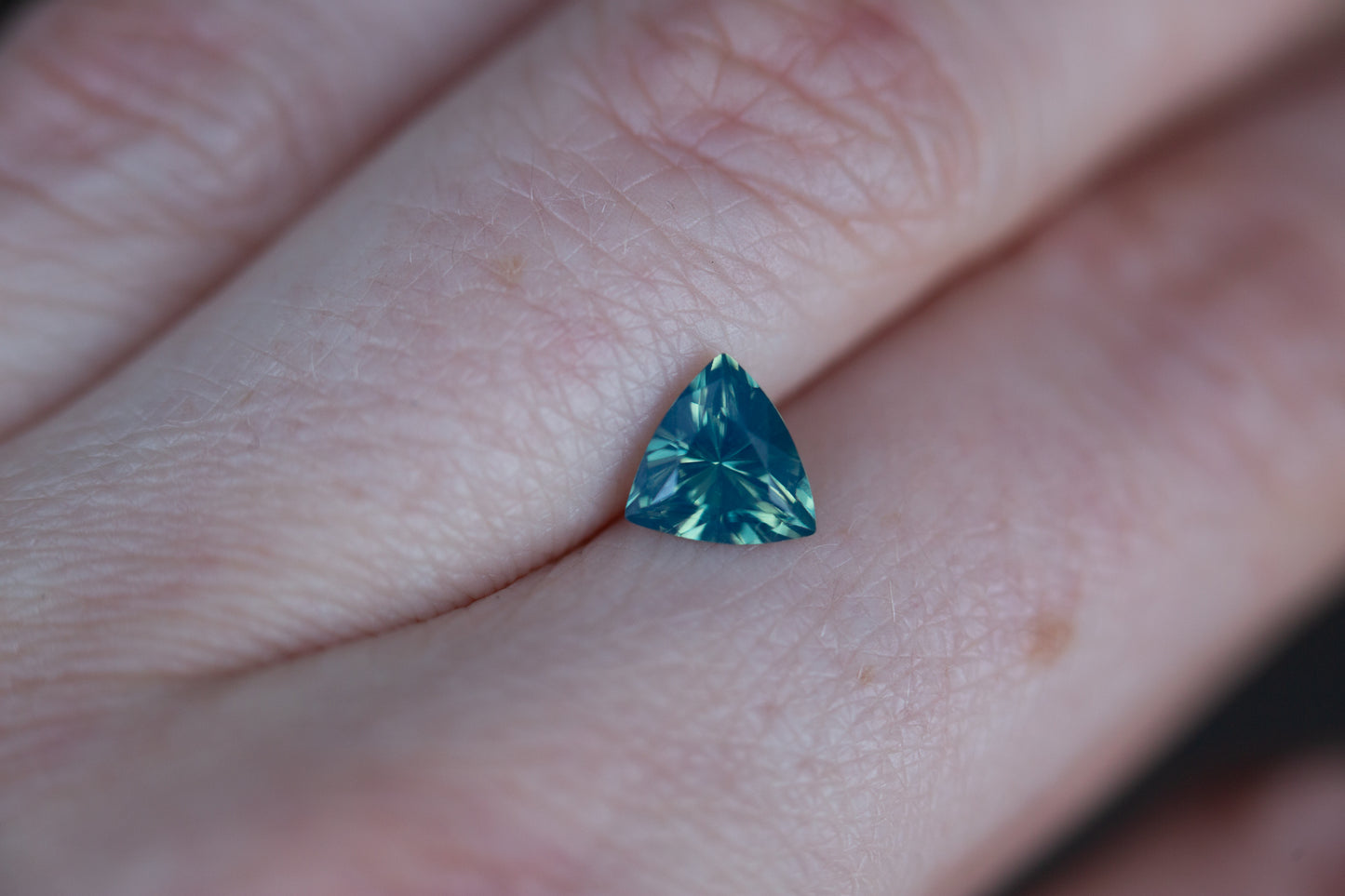 ON HOLD 1.28ct opalescent teal trillion sapphire