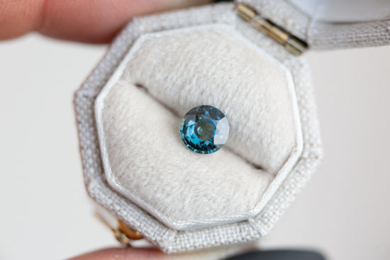 .96ct round teal sapphire