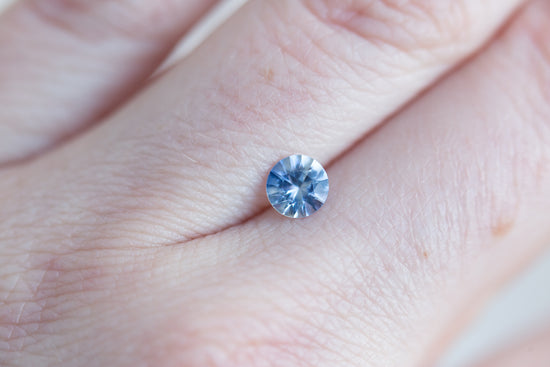 Load image into Gallery viewer, .63ct round opaque light blue sapphire
