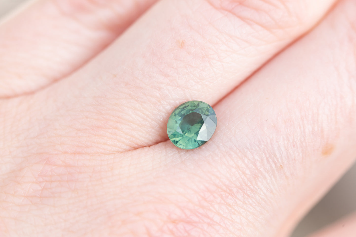 1.75ct oval teal green sapphire