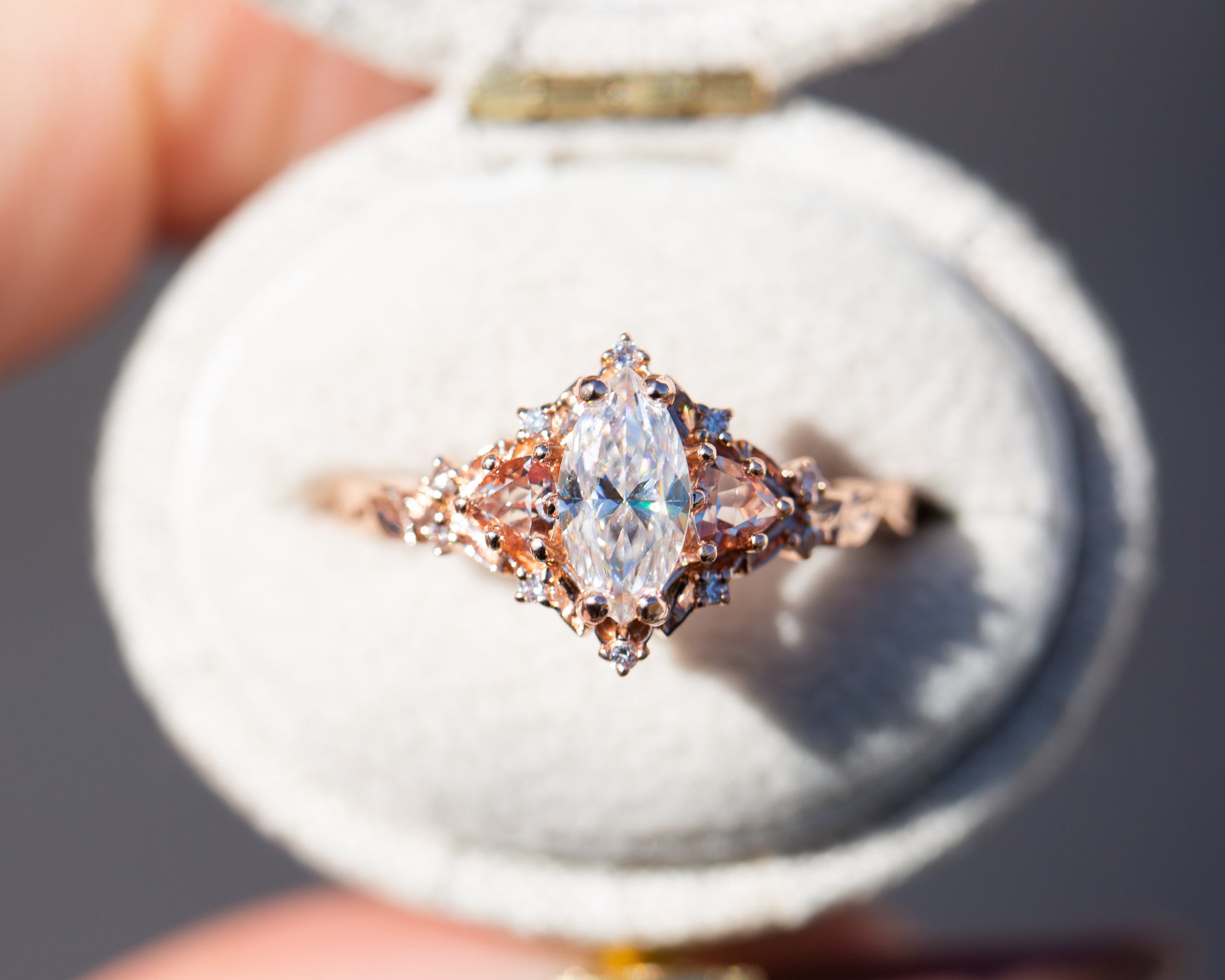Briar rose three stone with marquise moissanite and lab peach sapphire Oore Jewelry