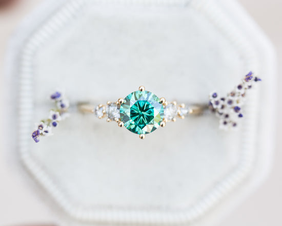 Load image into Gallery viewer, Round green moissanite five stone ring with salt and pepper diamonds
