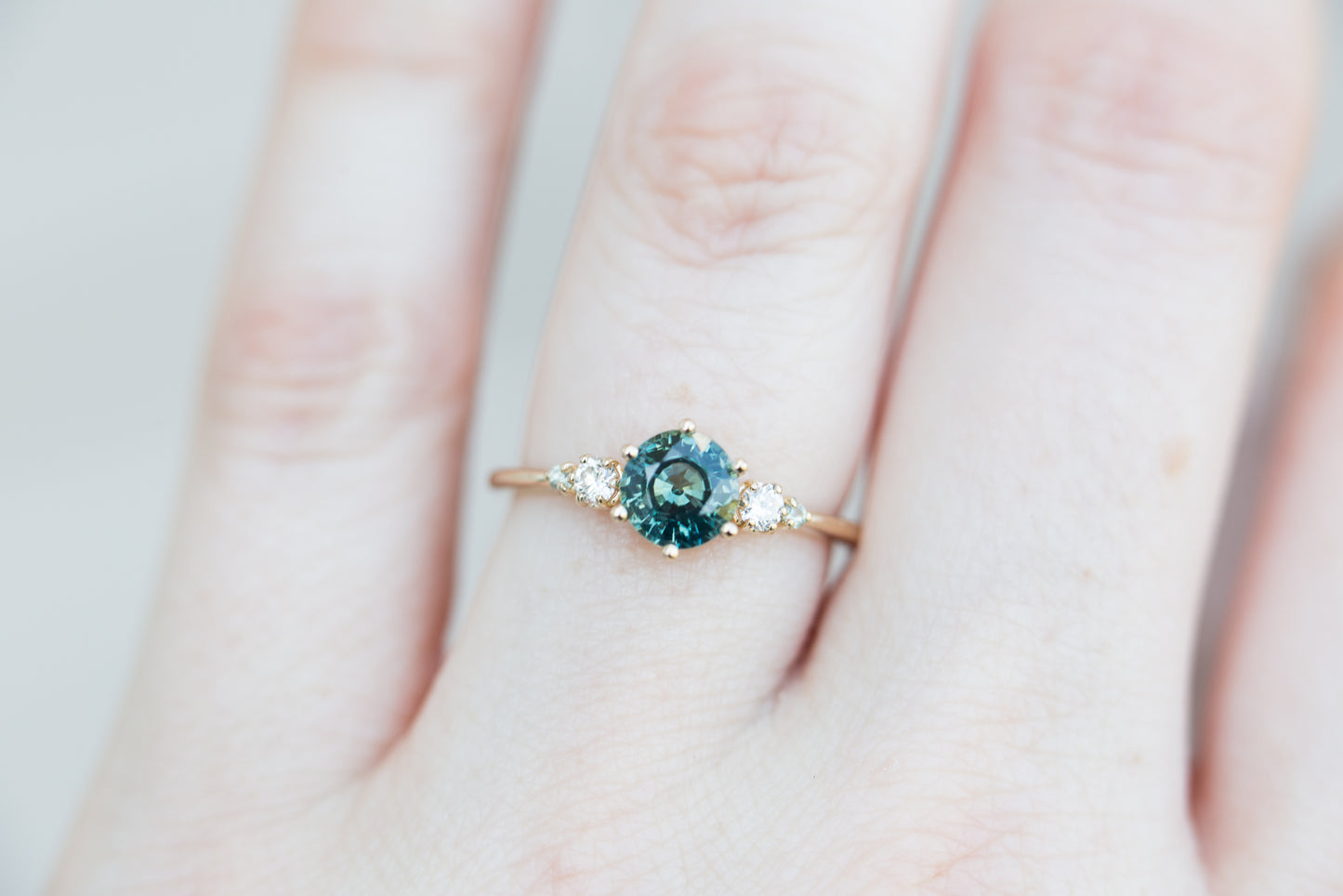 Load image into Gallery viewer, Round teal sapphire five stone ring
