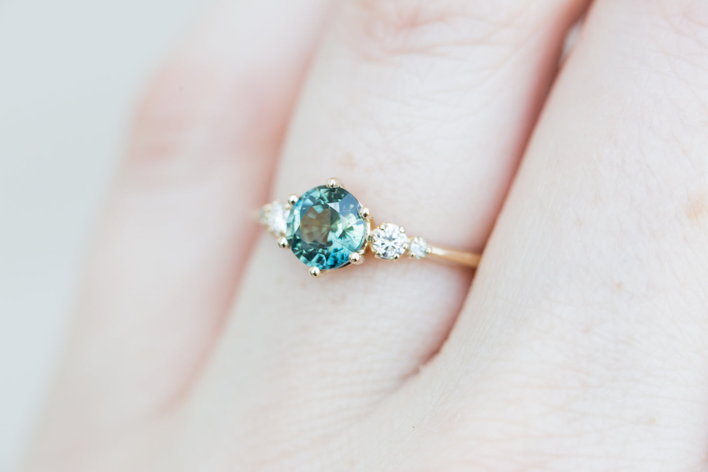 Load image into Gallery viewer, Round teal sapphire five stone ring
