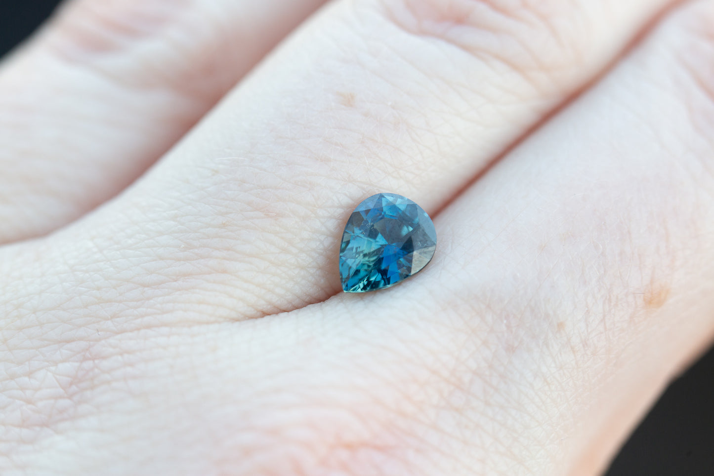 1.7ct pear deep blue teal sapphire