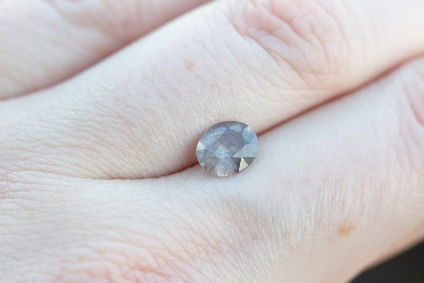 1.33ct oval opaque grey purple/peach sapphire