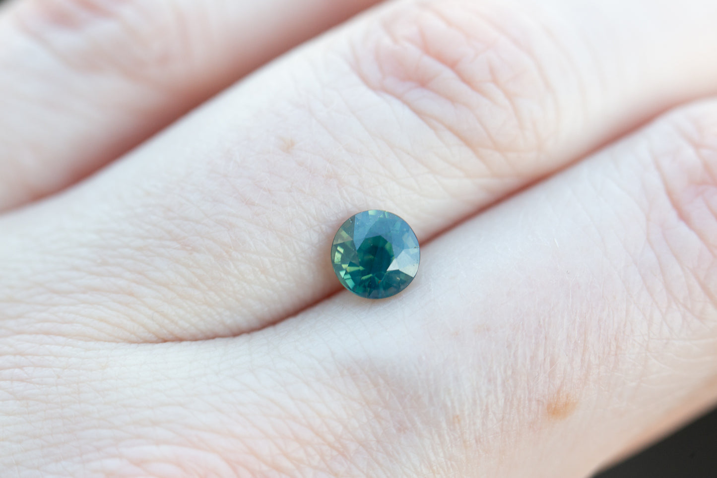 1.31ct round opalescent teal blue green sapphire