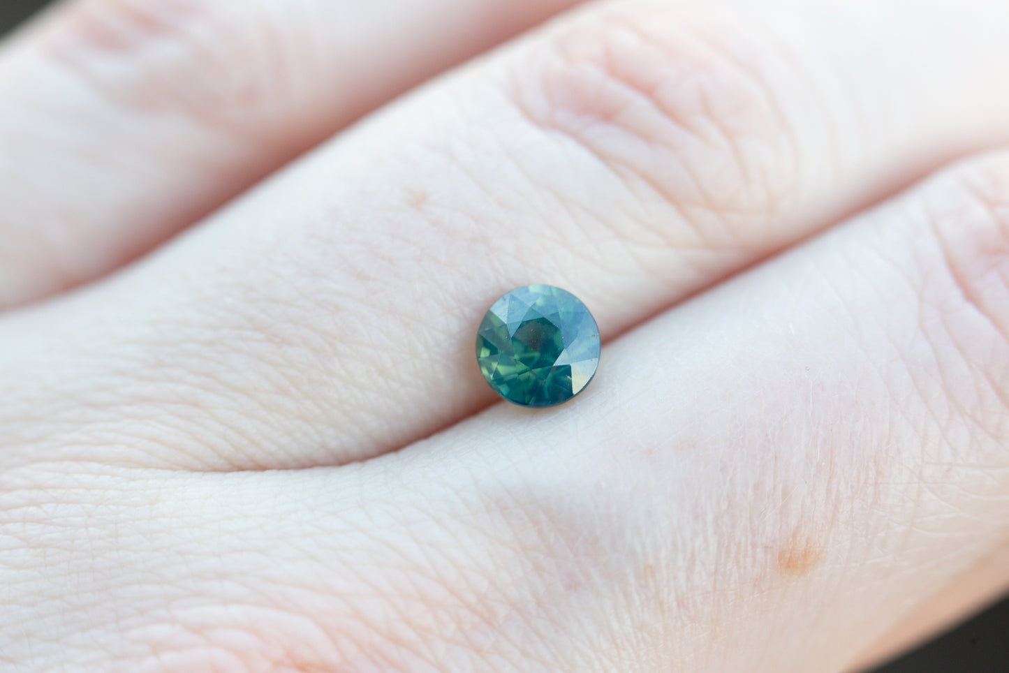 1.31ct round opalescent teal blue green sapphire