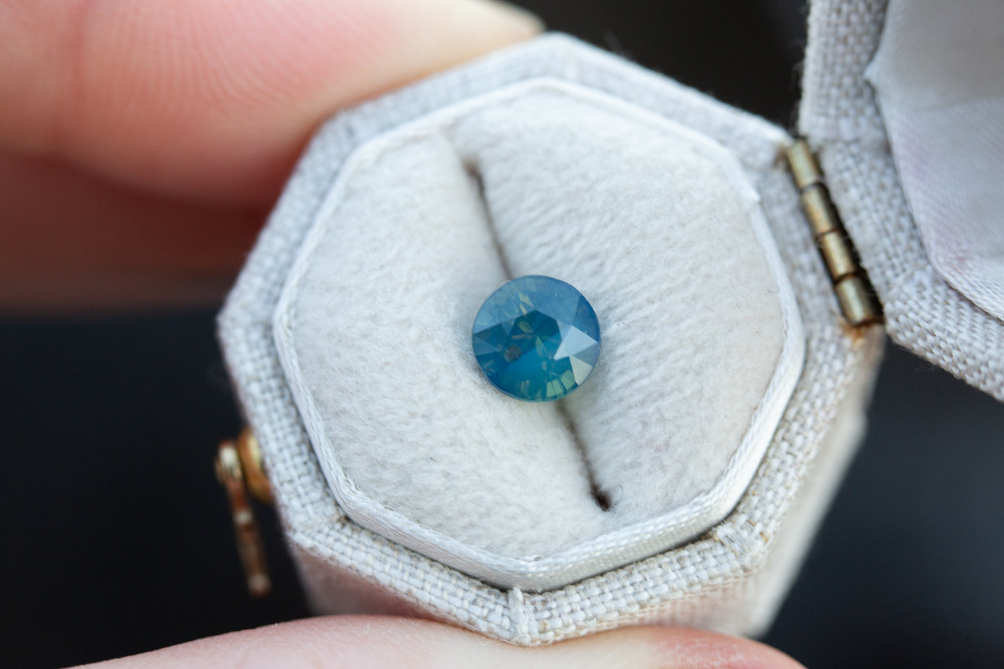 1.53ct round opalescent blue green sapphire