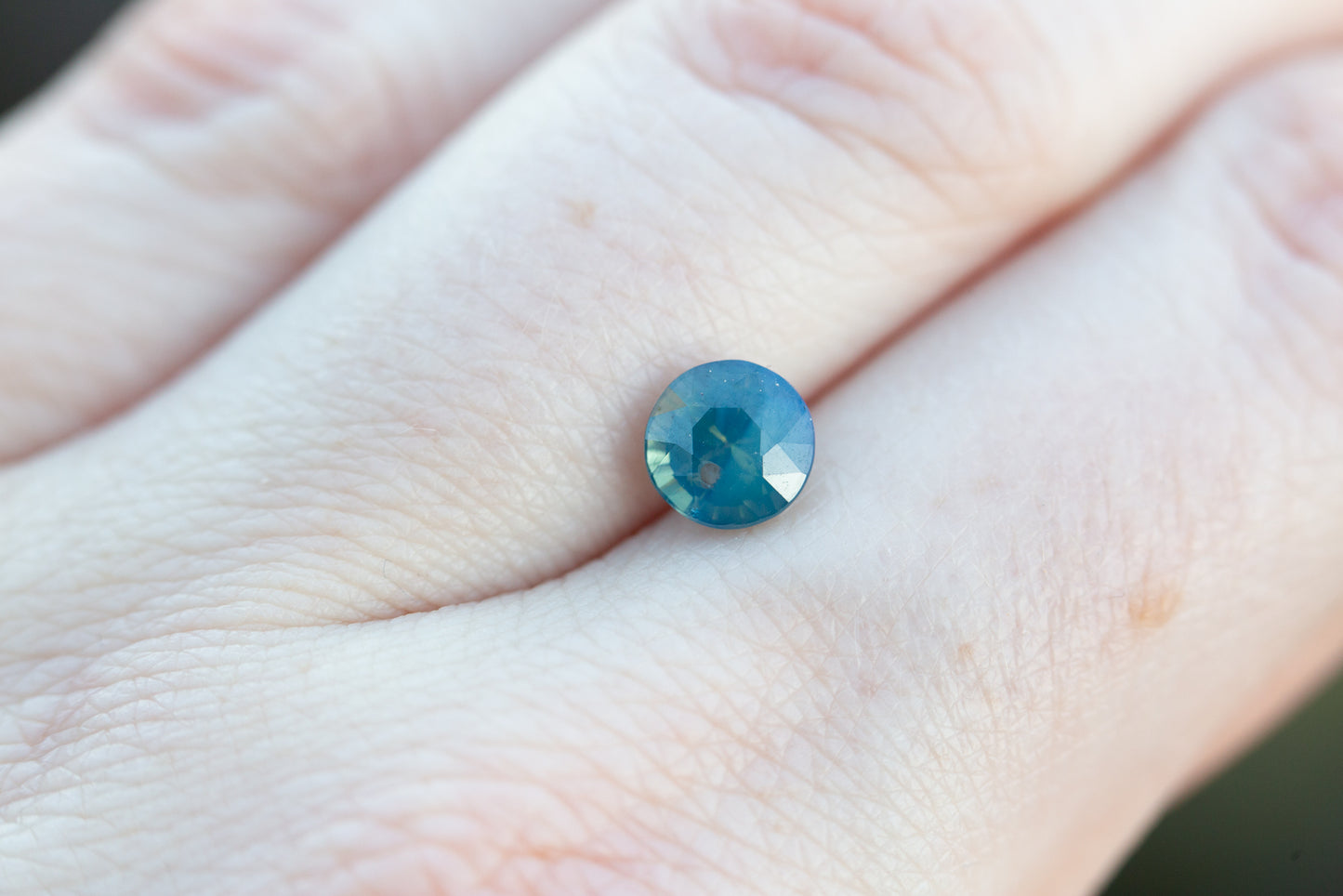 1.53ct round opalescent blue green sapphire