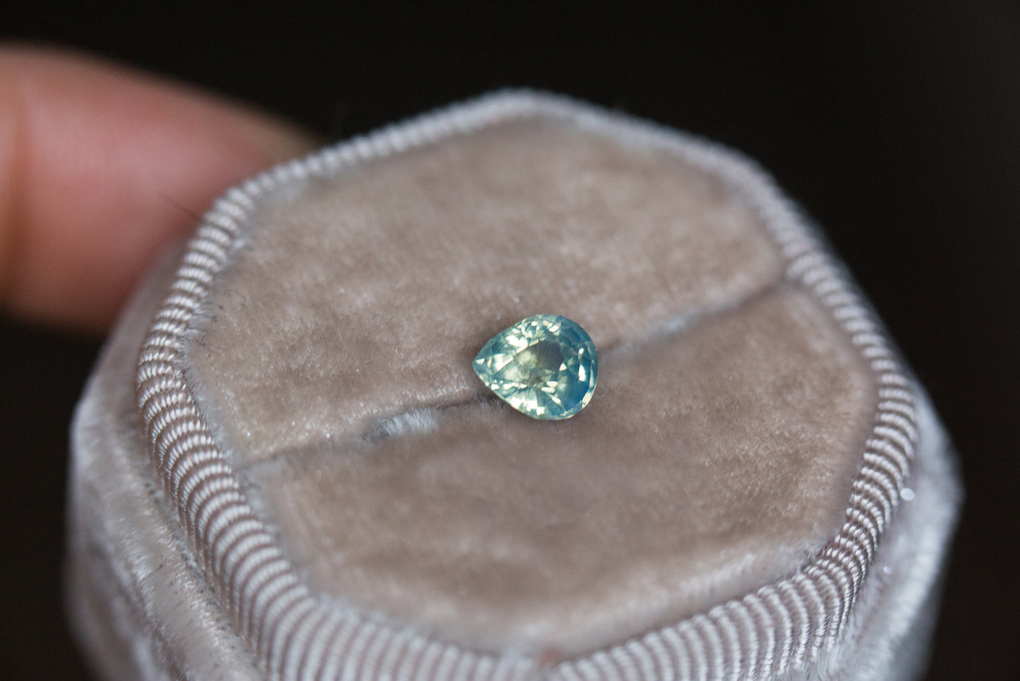 1.1ct light teal opalescent sapphire