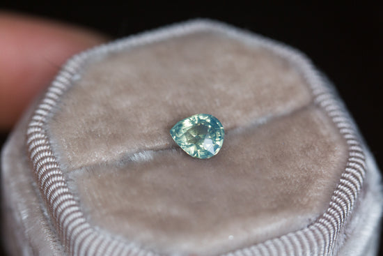 1.1ct light teal opalescent sapphire