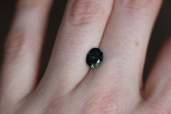 1.56ct oval dark blue green sapphire