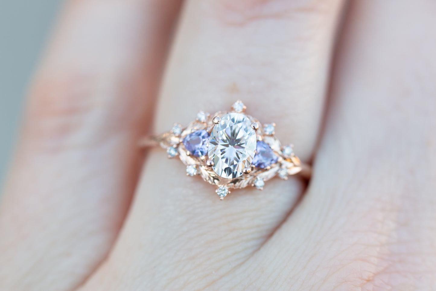 Woodland setting with oval moissanite and tanzanite