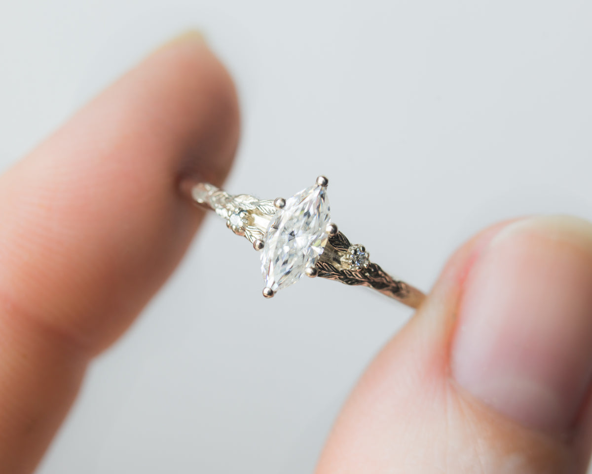 Marquise moissanite leaf cathedral engagement ring