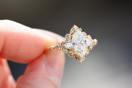 Aurora three stone with marquise moissanite