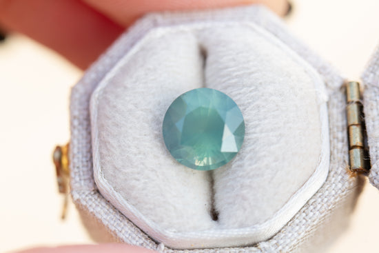 3.29ct round opaque light teal blue sapphire