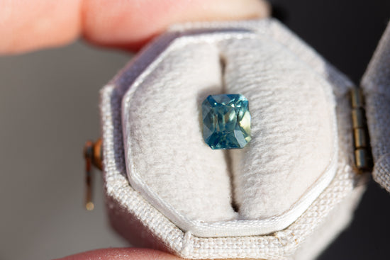 1.62ct emerald cut parti teal, blue, green sapphire