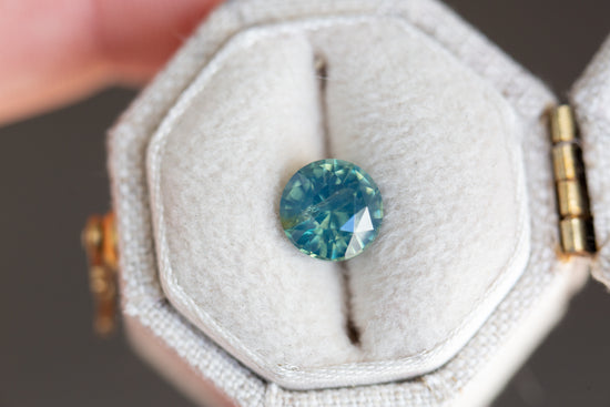 1.75ct round opalescent teal sapphire