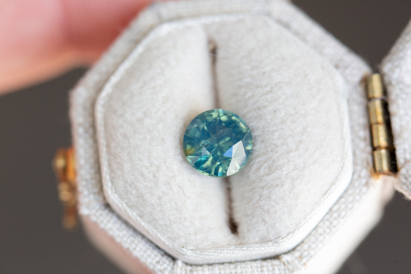 1.75ct round opalescent teal sapphire