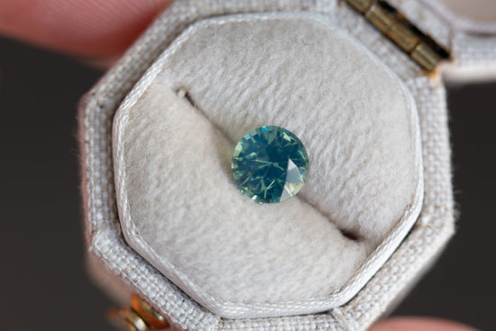 1.35ct round opalescent teal sapphire