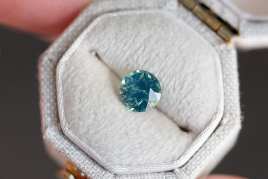 1.35ct round opalescent teal sapphire