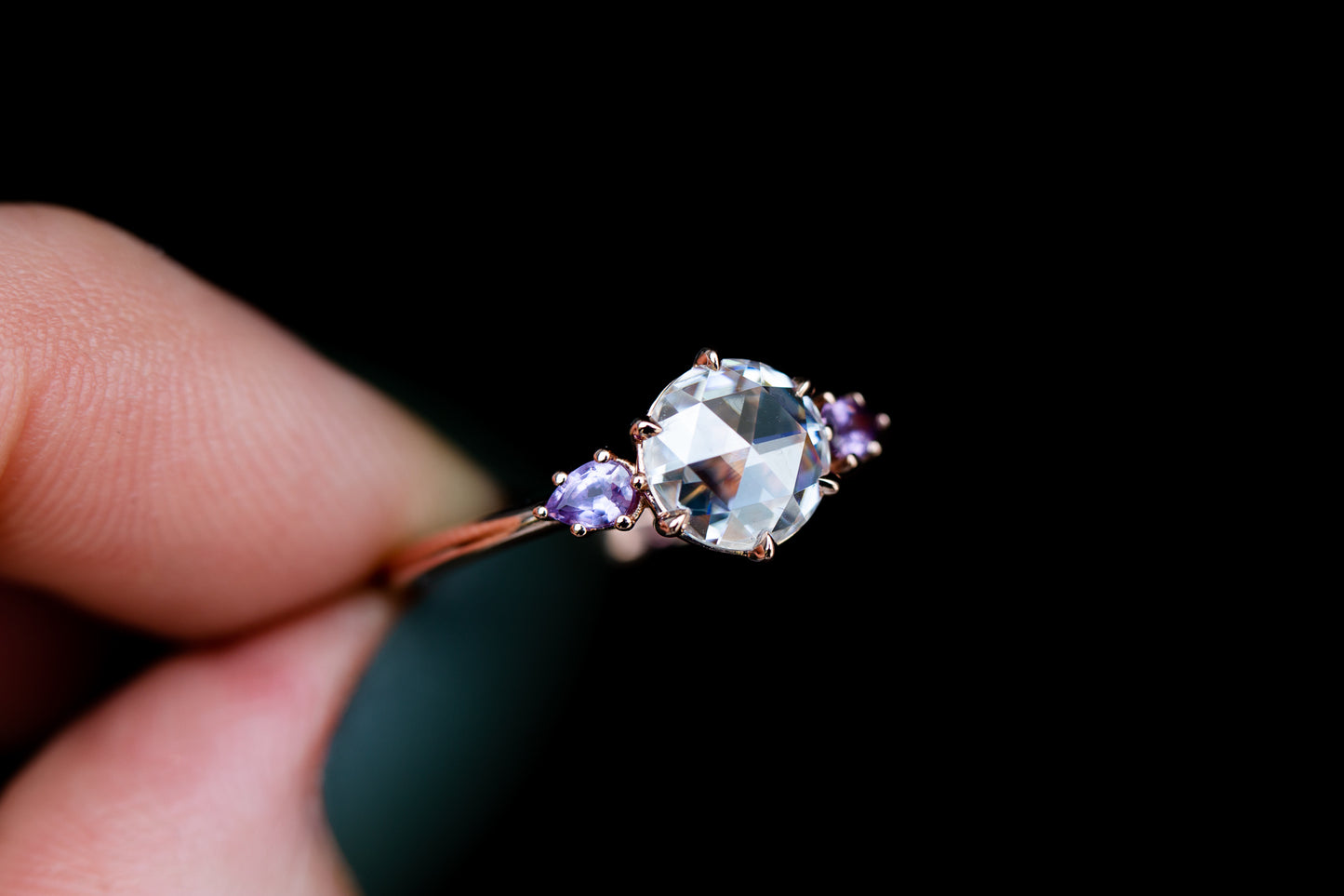 Rose cut moissanite three stone ring with purple sapphire side stones