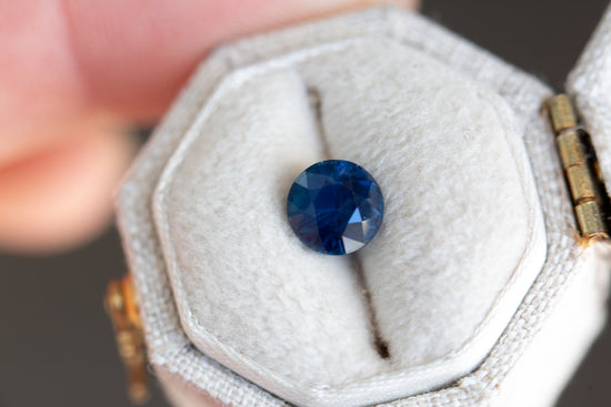 1.5ct round opaque deep dark blue sapphire