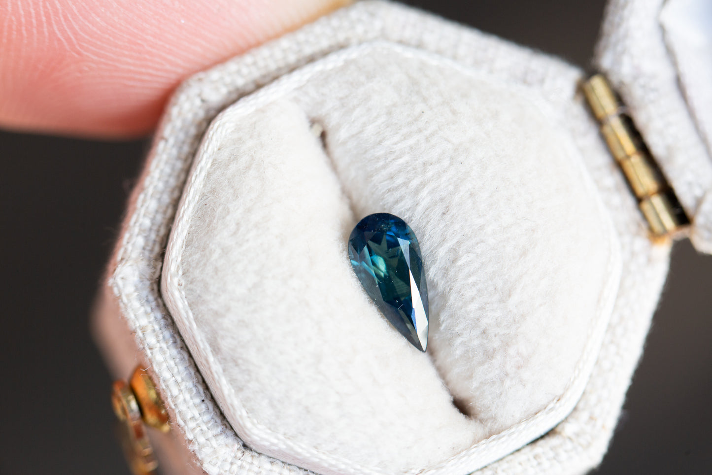 Load image into Gallery viewer, .67ct elongated pear dark blue green sapphire
