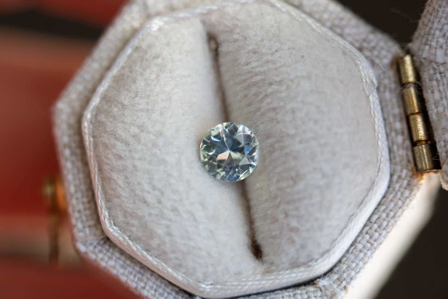 Load image into Gallery viewer, .53ct round very pale light green/blue sapphire
