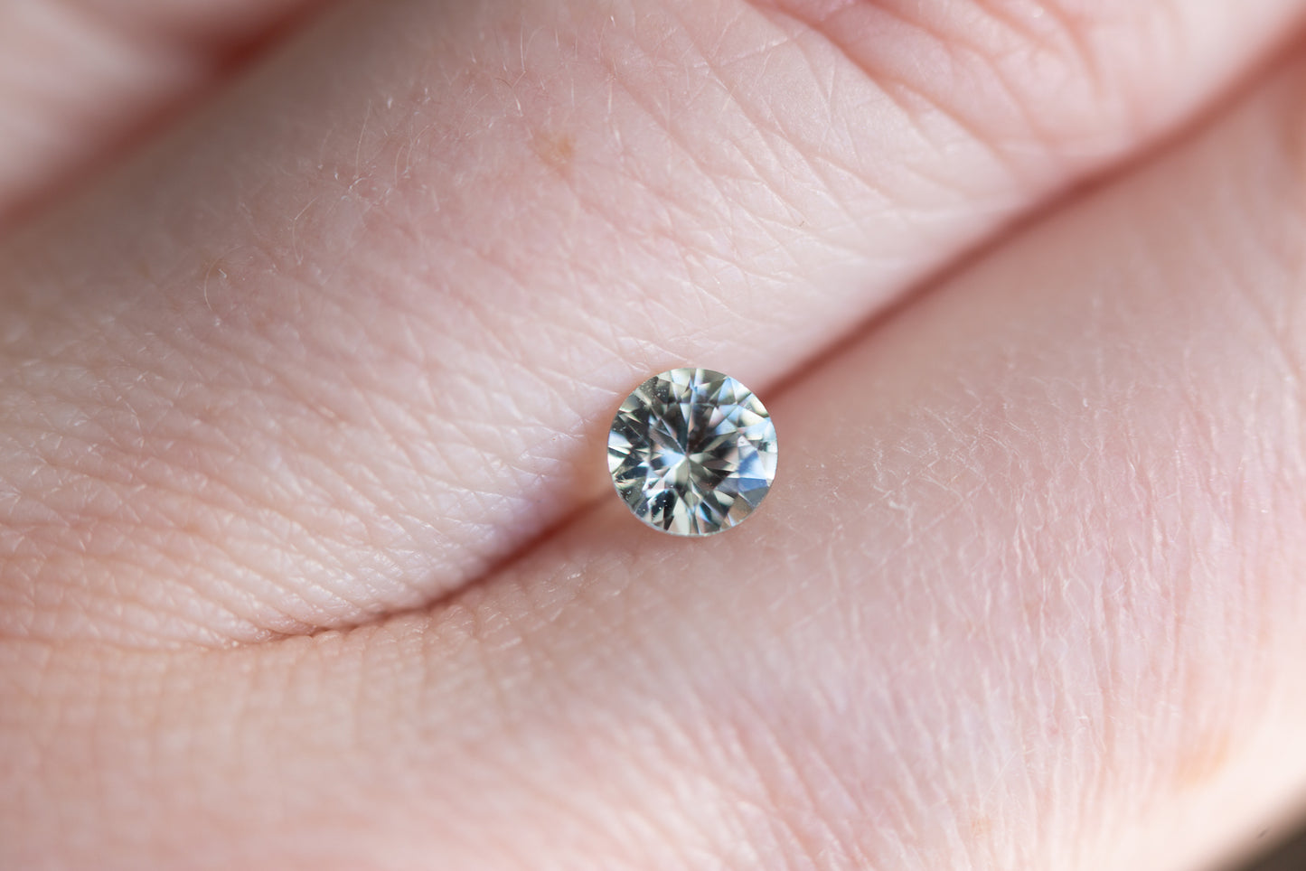 .59ct round very pale blue green sapphire